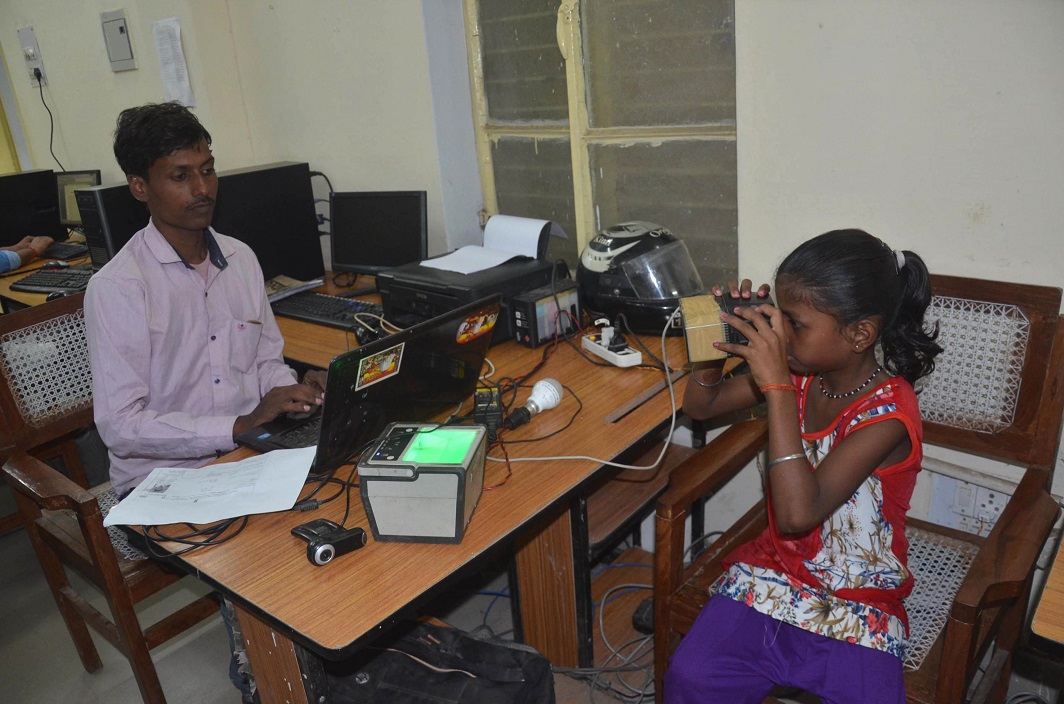 A girl getting her retina scanned as she enrolls for Aadhaar, at a camp in Mirzapur (file picture). Photo: UNI