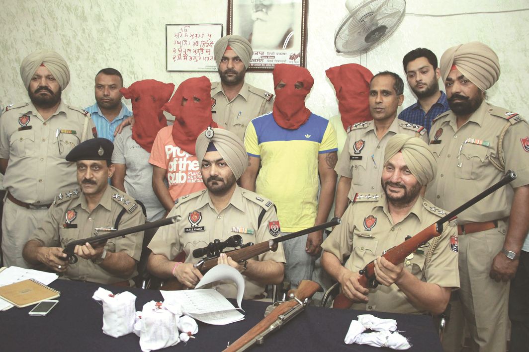 Punjab police showing weapons recovered from four members of a contract killer gang in Jalandhar. Photo: UNI
