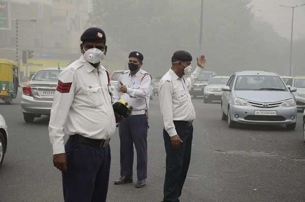 Traffic police wearing pollution mask