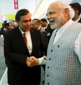 Chairman and MD of RIL, Mukesh Ambani with Prime Minister Narendra Modi. RIL has seized the chance to launch Jio payments, in a joint venture with SBI Chairman and MD of RIL, Mukesh Ambani with Prime Minister Narendra Modi. RIL has seized the chance to launch Jio payments, in a joint venture with SBI