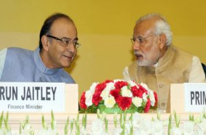 A file picture of Prime Minister Narendra Modi in conversation with Union Finance Minister Arun Jaitley (Left) during the Delhi Economics Conclave 2015, in New Delhi. Photo: UNI