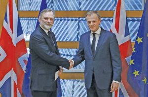 Britain’s envoy to the European Union Tim Barrow (left) delivers PM Theresa May’s Brexit letter to EU Council’s president Donald Tusk in Brussels, Belgium. Photo: UNI