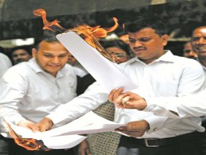 Lawyers burn a copy of the Law Commission’s recommendations in Delhi on April 21. Photo: Anil Shakya