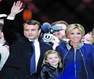 Macron with his wife and mentor Brigitte Trogneux, who is 24 years his senior. Photo: UNI