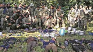 CRPF personnel with the bodies of CPI (Maoists) members after a gunbattle at Chipadohar Forest in Jharkhand. Photo: UNI