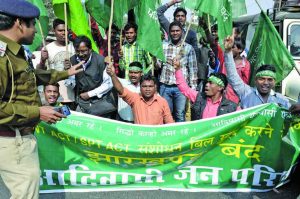 Activists of Adivasi Jan Parishad agitate on the land acquisition issue in Ranchi. Mining projects are often at variance with their livelihood. Photo: UNI