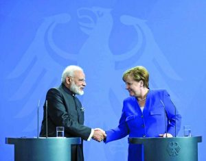 Prime Minister Modi with German Chancellor Angela Merkel in Berlin. Photo: UNI