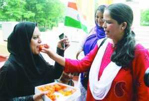 Muslim women offering sweets to each other in Lucknow following the Supreme Court order on triple talaq. Photo: UNI