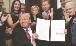 US President Donald Trump after signing an executive order to make it easier to buy bare-bone health insurance. Photo: UNI