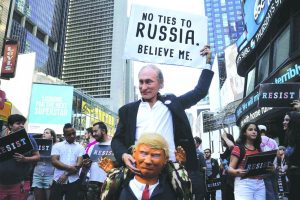 Protestors dressed as Russia's President Vladimir Putin and US President Donald Trump, in New York. Photo: UNI