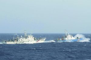 A marine guard ship from Vietnam (right in the picture) near a Chinese ship in the South China Sea. Photo: UNI