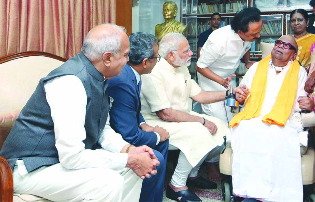 PM Narendra Modi calling on DMK leader M Karunanidhi at his residence in Chennai. Photo: UNI