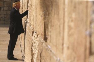 President Trump spends a quiet moment at the Wailing Wall, Jerusalem, in May. Photo: UNI