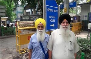 Tejinderpal Singh (far left) and Satnam Singh have been acquitted