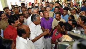 Chief Minister Pinarayi Vijayan talks to flood victims at a relief camp near Chengannur in Kerala/Photo Courtesy: Big News Live