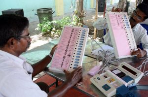 Election officials pasting name and symbol on EVMs before dispatching to the polling booths ahead of Tamil Nadu Assembly Elections, in Chennai on Tuesday (file pic)/Photo: UNI