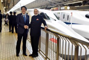Prime Minister Narendra Modi and Prime Minister of Japan Shinzo Abe at Tokyo Station to board the Shinkansen bullet train to Kobe, in Japan (file pic)/Photo:UNI