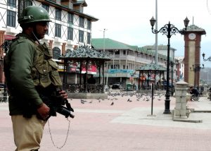 An armyman keeping vigil at Lal Chowk, Srinagar, during a strike called against the ban of JKLF/Photo: UNI