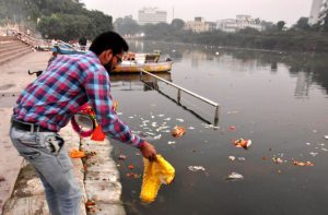 Materials used in religious rituals being dumped into the Gomti post-Diwali/Photo: UNI