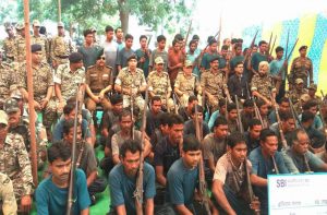62 Naxalites surrendering before senior police officers in Narayanpur district in Chhattisgarh in November last year/Photo: UNI