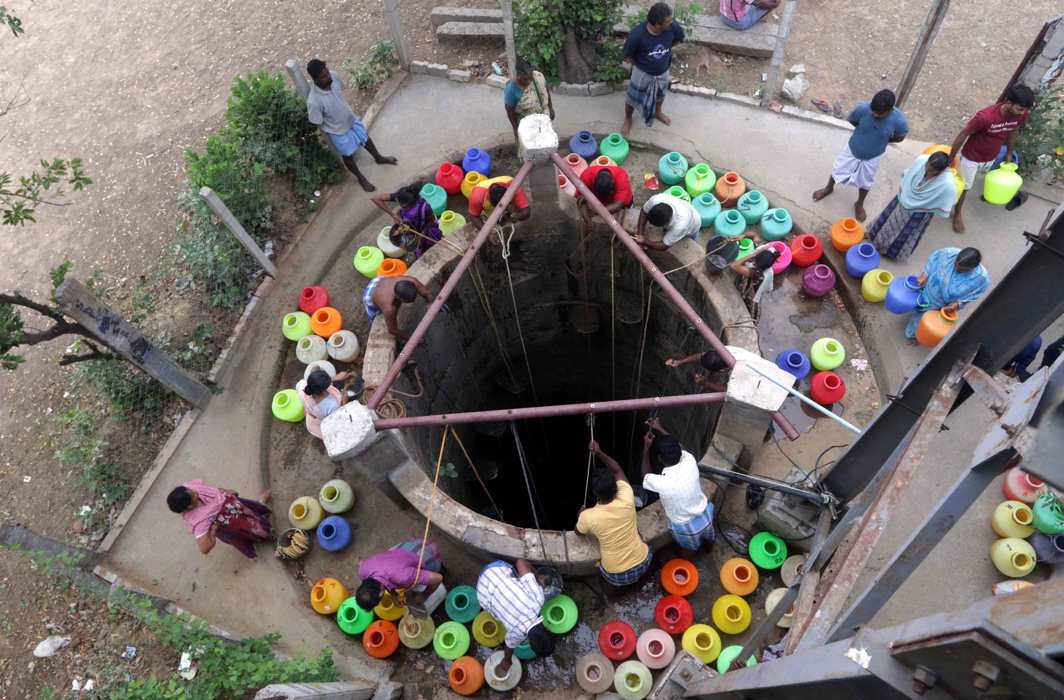 People fill plastic pots from a well in Chennai which is experiencing severe water crisis; a restaurant in the city remains shut due to water shortage/Photo: UNI