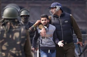 A protesting youth being arrested in Srinagar/Photo: UNI