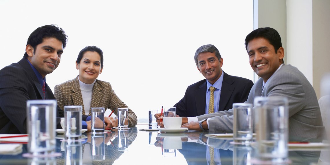 group-of-executives-in-an-office-business-meeting - India Legal