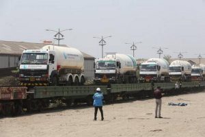 Empty tanker trucks get loaded at Kalamboli on Monday on train and will return in four days.
