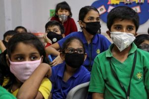kids in kolkata in the classroom with mask.