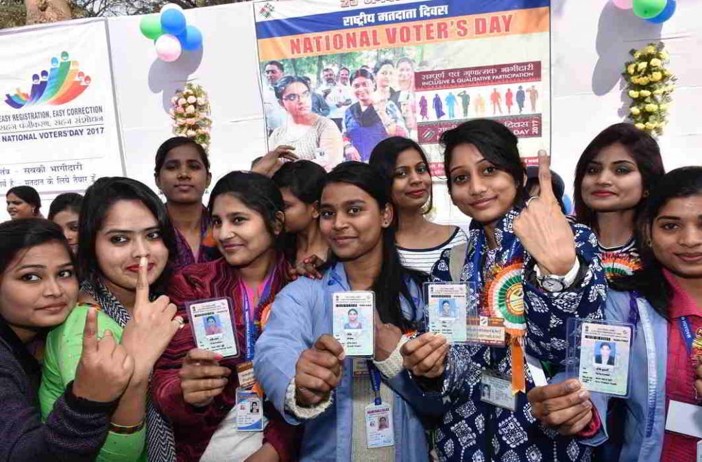 Youth showing their Election card