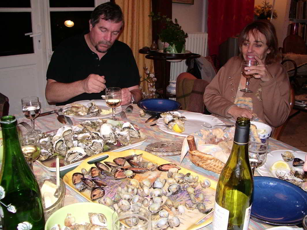 Enjoying a meal of fresh snails and oysters at home