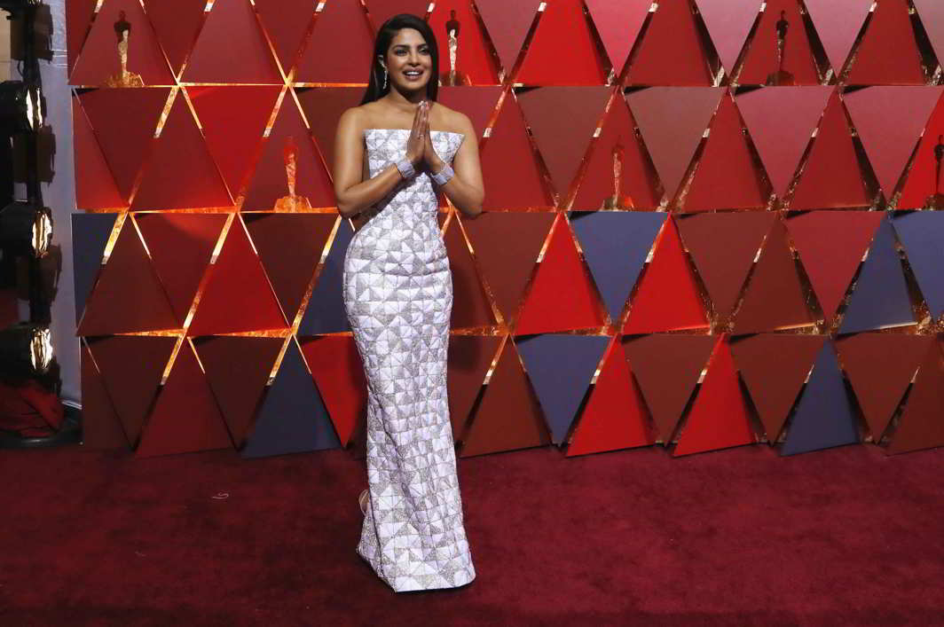 WHEN BOLLYWOOD ARRIVES IN HOLLYWOOD: Actor Priyanka Chopra gestures on the red carpet at the 89th Academy Awards during Oscars Red Carpet Arrivals, Hollywood, California, US, Reuters/UNI