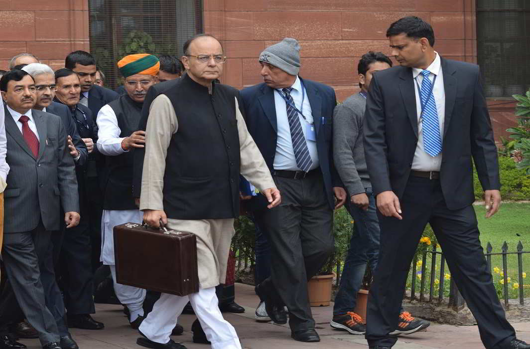 Union Finance Minister Arun Jaitley with Ministry officials coming out of North Block office on way to Parliament house to present the General Budget for the year 2017-18 in New Delhi on Wednesday. UNI PHOTO-3U