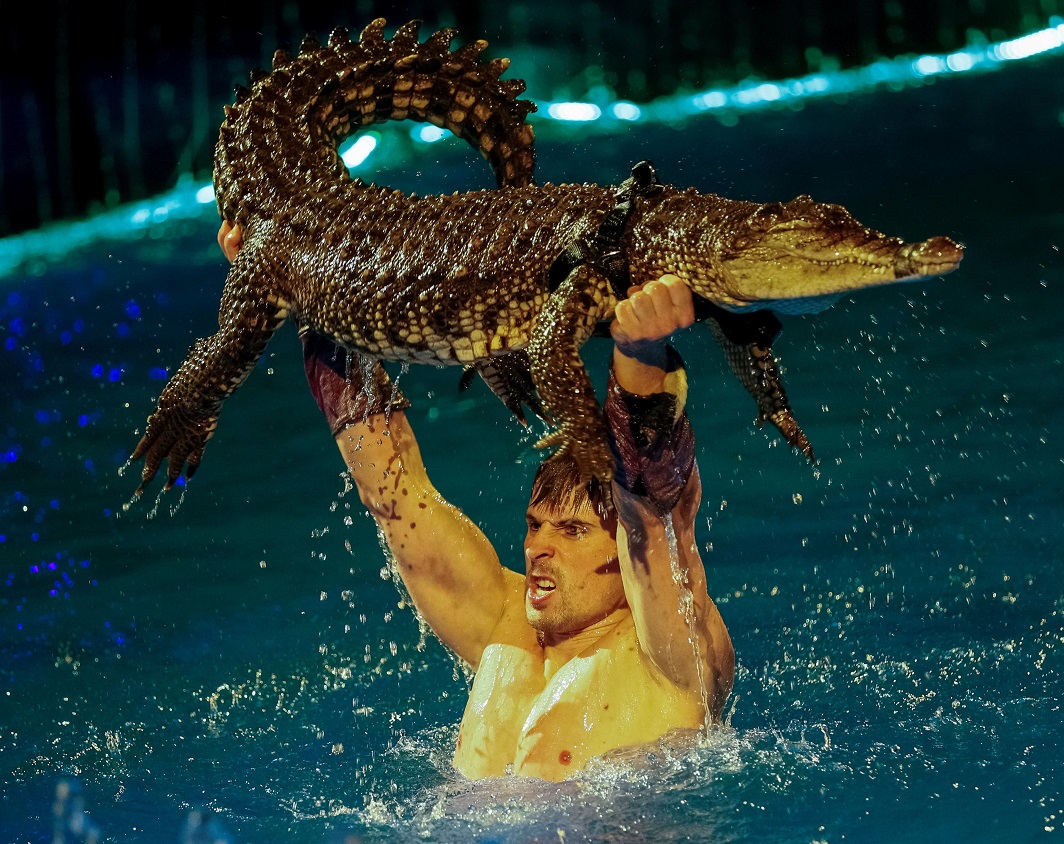 BECAUSE HE CAN: A crocodile and its tamer perform during the presentation of the new show, Water and Fire, at National Circus in Kiev, Ukraine, Reuters/UNI