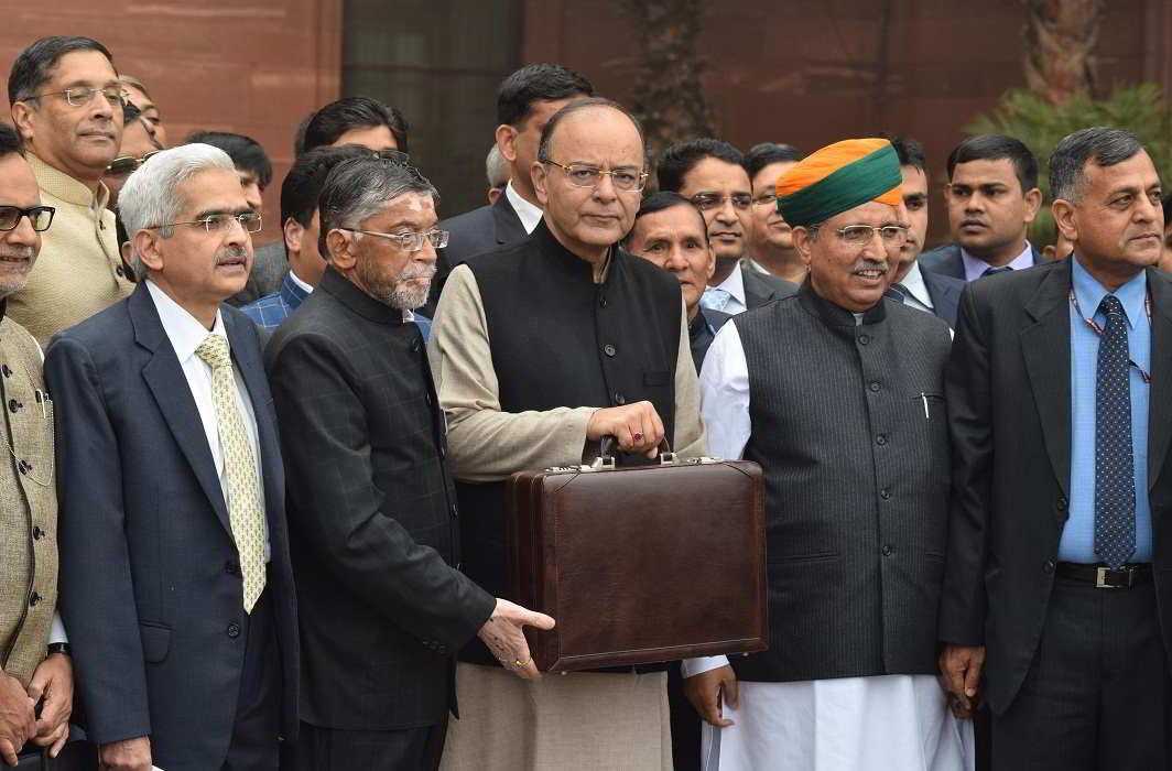 Union Finance Minister Arun Jaitley with Minister of State, Arjun Ram Meghwal and Santosh Gangwar coming out of North Block office on way to Parliament house to present the General Budget for the year 2017-18 in New Delhi. Photo: UNI