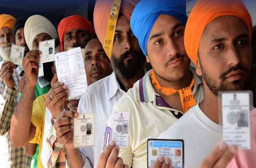 Voters wait in queue to casting vote during Punjab assembly polls at a polling station in Hoshiarpur on February 4, UNI