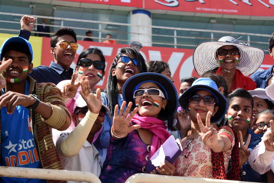 WE WANT VICTORY: Cricket fans cheer during the third day of the third Test against Australia at JSCA stadium in Ranchi, UNI