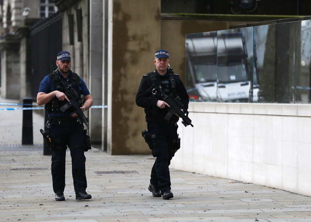 Armed police officers patrol on Whitehall the morning after the London attack, Reuters/UNI
