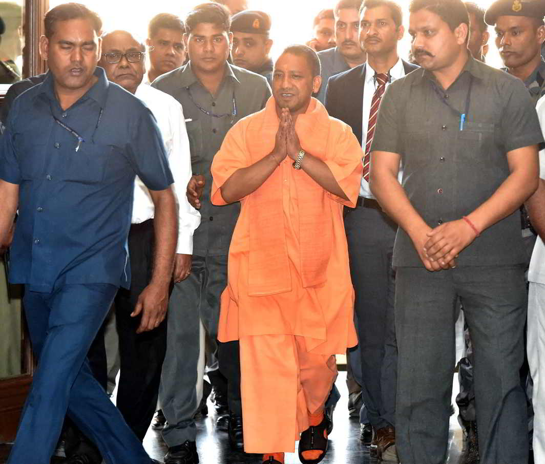 FIRST DAY AT WORK: Uttar Pradesh Chief Minister Yogi Adityanath arrives for a meeting with police officers in Lucknow, UNI