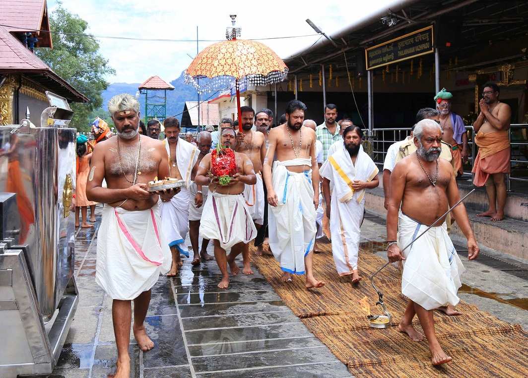 GOD ON THE HILL: The 'Kalabham Ezhunnallathu' ritual being performed at lord Ayyapppa temple at Sabarimala, UNI