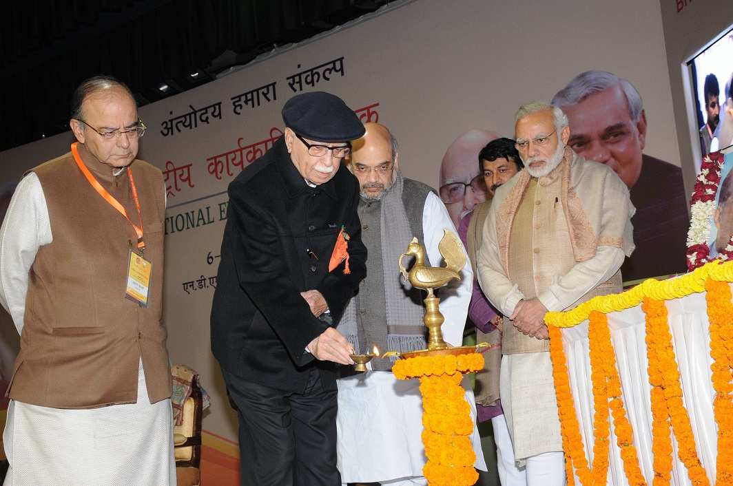 THREE’S COMPANY: Senior BJP leader LK Advani with Prime Minister Narendra Modi, BJP national president Amit Shah and Union finance minister Arun Jaitley light the ceremonial lamp to inaugurate a BJP National Executive Meeting, UNI