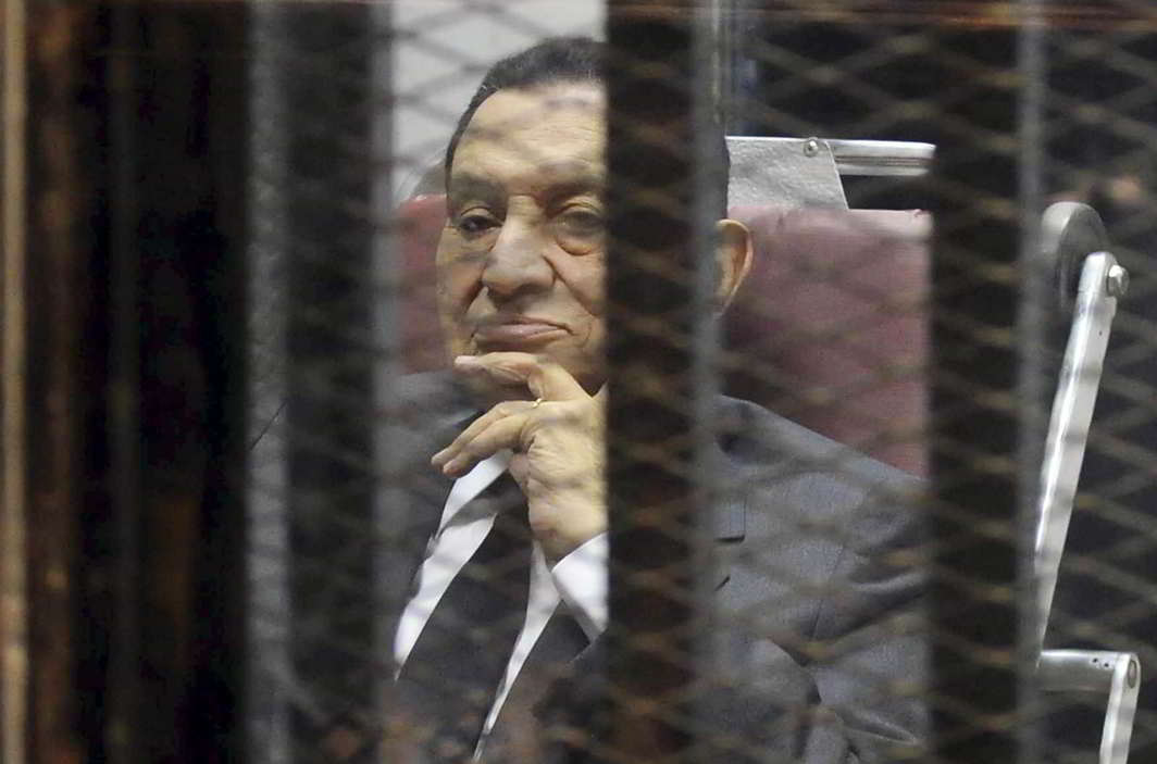 CHEATER OF MISFORTUNE: Egypt’s ousted president Hosni Mubarak inside a dock at the police academy on the outskirts of Cairo in 2014. An Egyptian court sentenced him to three years in prison on charges of stealing public funds, Reuters/UNI