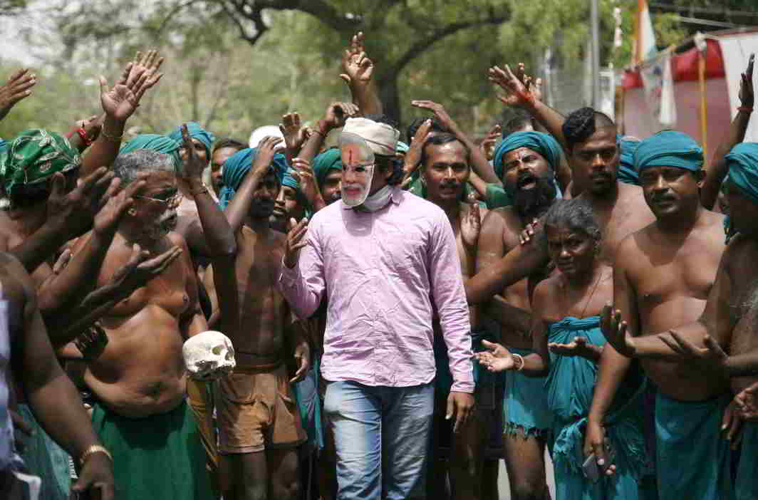 UNIQUE PROTEST: Farmers present their case before an authority figure, symbolised by a man in a Modi mask