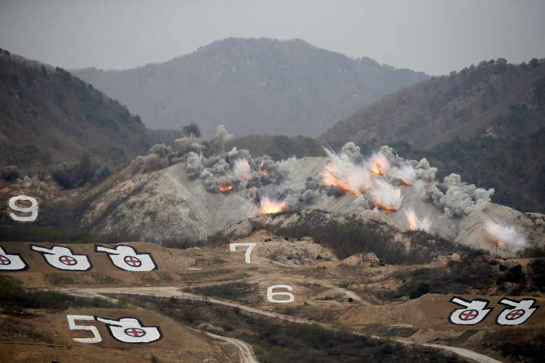 NO MAN’S LAND: Explosions are seen at a target, during a US-South Korea joint live-fire military exercise, at a training field, near the demilitarized zone, separating the two Koreas in Pocheon, South Korea, Reuters/UNI