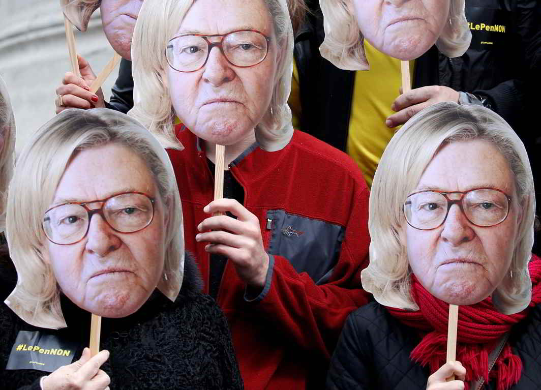 LEFT SENTIMENT: Activists wear masks depicting the face of Jean-Marie Le Pen, the founder of the French far-right National Front, with the hair of his daughter Marine Le Pen, French National Front (FN) candidate for 2017 presidential election, during a demonstration in Paris on Labour Day, Reuters/UNI