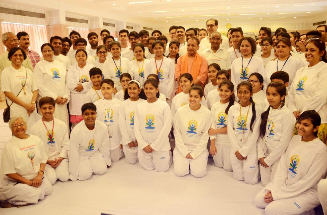 BEST FOOT FORWARD: Uttar Pradesh Chief Minister Yogi Adityanath interacts with the students of City Montessory School going to the US to perform on International Yoga Day, in Lucknow, UNI