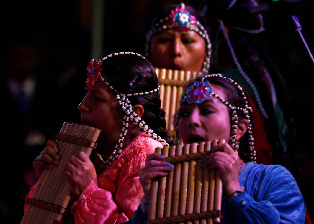 NOTES FROM THE SOUL: A Bolivian troupe performs on the pan flute at the closing ceremony of World People Conference in Tiquipaya, Cochabamba, Bolivia, Reuters/UNI