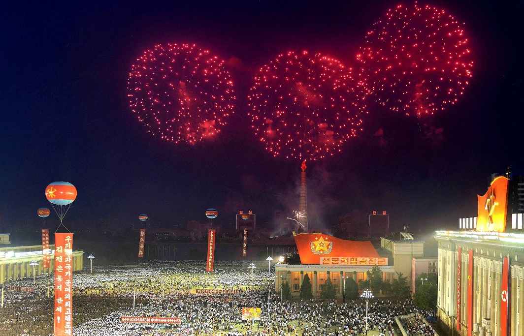 RUBY SHOWERS: Army personnel and people gather at Kim Il Sung Square in Pyongyang to celebrate the successful test-launch of intercontinental ballistic rocket Hwasong-14 in Pyongyang. Korean Central News Agency/Reuters/UNI