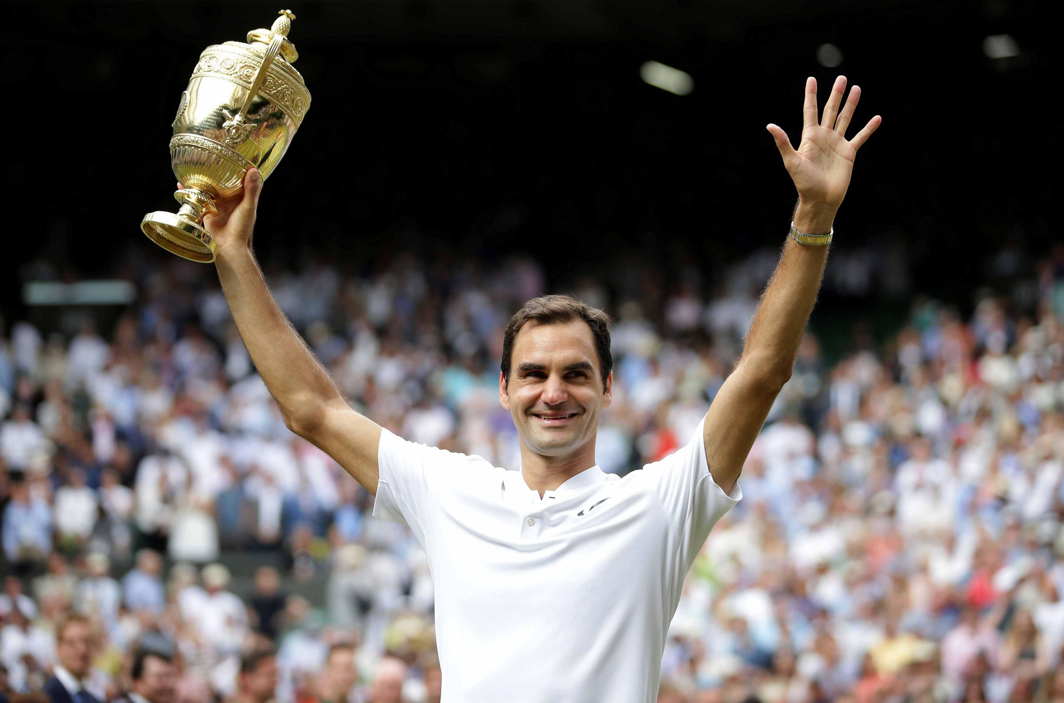 G.O.A.T: Roger Federer poses with the trophy after winning his eighth men’s singles title and 19th Grand Slam, becoming the oldest male player to do so and the only person since Bjorn Borg to win the championship without dropping a set. He now has the highest number of Wimbledon titles as well as Grand Slams in men’s tennis. He beat Croatia’s Marin Cilic in straight sets with a 6-3, 6-1, 6-4 scoreline -Photo courtesy: Reuters/UNI