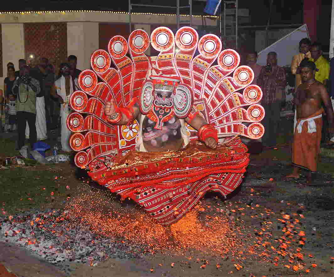 BOOM SHAKALA: An artiste performs the Theechamundi Theyyam, a ritual fire dance of Malabar, on burning embers as per tradition in Lavanyam 2017 as part of Onam celebrations at Fort Kochi, UNI